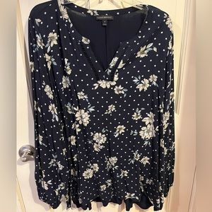Long sleeve navy top with white and yellow flowers.